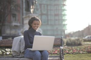 A woman reading a recruiting marketing blog for job seekers